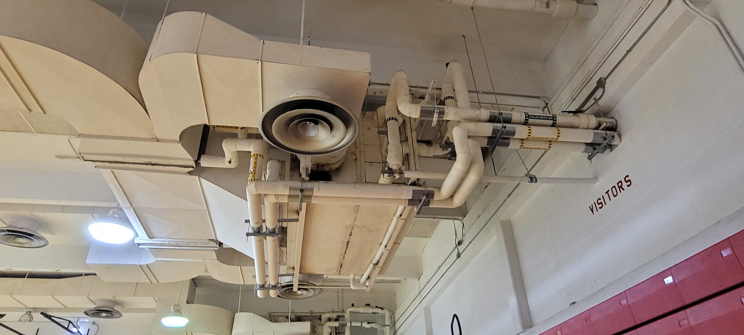 The HVAC unit in the Royal Junior High gymnasium regularly drips moisture onto the floor due to decayed insulation and age of the unit, staff said. This causes the need for repeated and expensive repairs to the flooring beneath the two units.